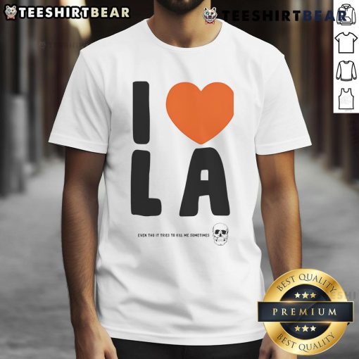 Alt Text: Funny I Love LA Even Though It Tries to Kill Me Sometimes T-Shirt showcasing humor about life in Los Angeles.