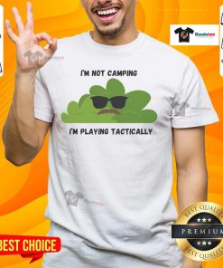Alt Text: Funny I'M Not Camping I'M Playing Tactically Cool Bush T-Shirt design with playful graphics and bold text.