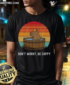 Alt Text: Funny retro 'Don't Worry Be Capy' capybara t-shirt design featuring a cheerful capybara illustration and vibrant colors.