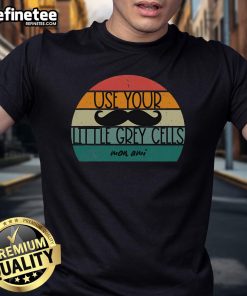 Vintage Poirot T-shirt featuring 'Use Your Little Grey Cells' slogan and iconic mustache design for detectives and Agatha Christie fans.