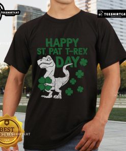 Happy St Pat T-Rex dinosaur wearing a green hat on an Irish t-shirt for St. Patrick's Day celebration.