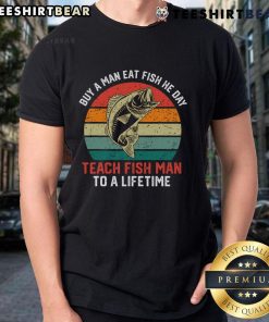 Vintage sunset T-shirt featuring 'Buy a man a fish, teach a man to fish' quote, perfect for fishing enthusiasts.