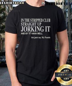 Man wearing a Peanits T-shirt at the Official In The Stripped Club, having fun and joking around with friends.