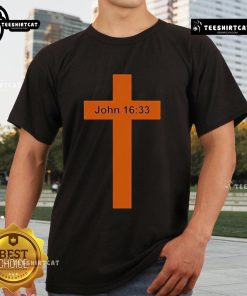Official Jesus Won Big One In Texas John 16:33 T-Shirt featuring bold text and vibrant colors for faith-inspired fashion.