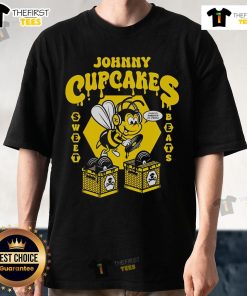 Alt Text: Official Johnny Cupcakes Sweet Beats Vinyl T-Shirt featuring vibrant graphics and a stylish design for music lovers.