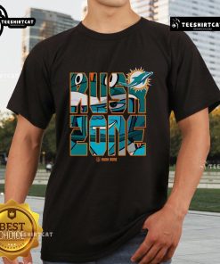 Alt Text: Official NFL Rush Zone Cartoon Miami Dolphins Football Logo T-Shirt featuring vibrant graphics and team colors.