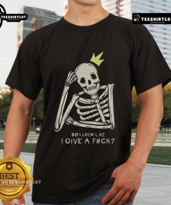 Alt Text: Official Skeleton Do I Look Like I Give A Fck T-Shirt featuring a bold skeleton graphic and humorous text design.