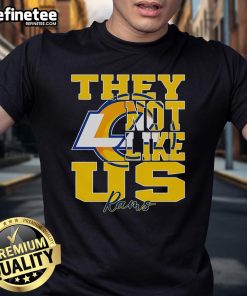 Official They Not Like Us Los Angeles Rams NFL football t-shirt featuring team colors and logo, perfect for fans.