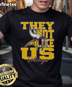Official They Not Like Us Minnesota Vikings NFL football T-shirt featuring bold team graphics and vibrant colors.