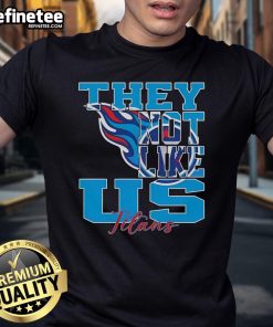 Official They Not Like Us Tennessee Titans NFL Football 2025 T-Shirt featuring team colors and logo for fans.