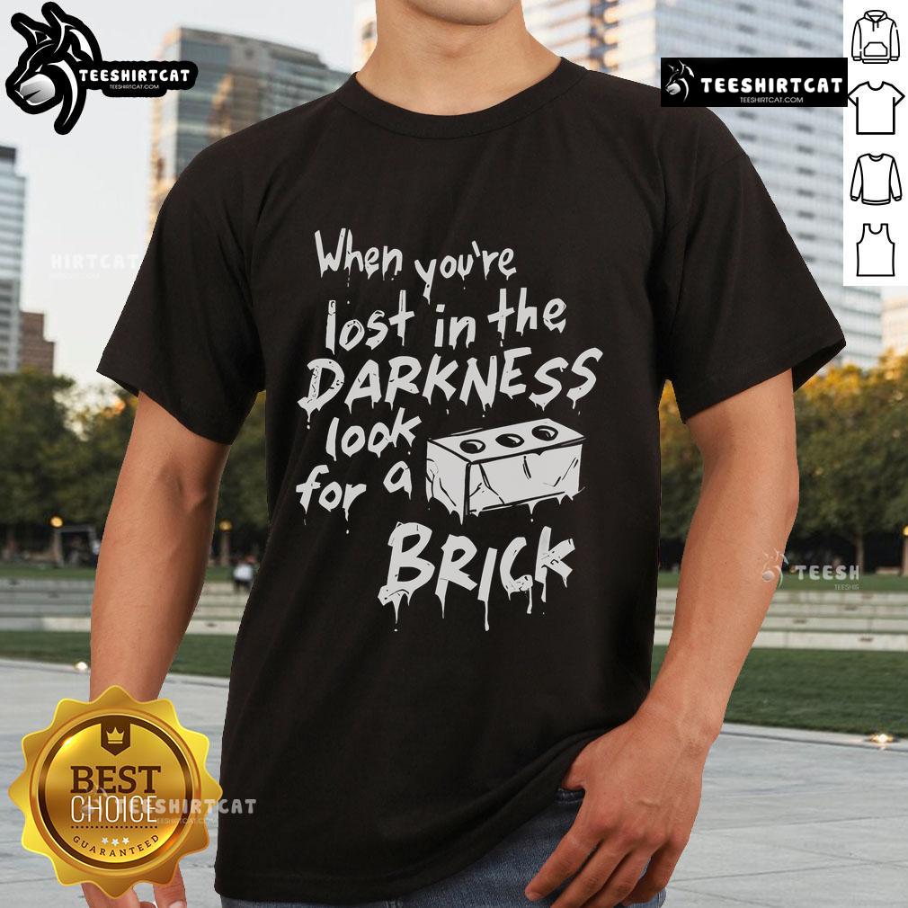 Official When You'Re Lost In The Darkness Look For A Brick T Shirt Official 'When You're Lost In The Darkness Look For A Brick' T-Shirt featuring a bold graphic design and stylish fit.