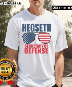 Alt Text: Top Hegseth Secretary of Defense sunglasses on a MAGA support T-shirt featuring Trumps pick for the role.
