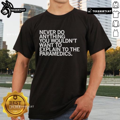 Top Never Do Anything You Wouldn't Want To Explain To The Paramedics T-Shirt design with humorous text on a casual tee.