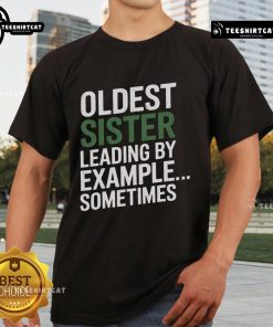 Top Oldest Sister Leading By Example Sometimes T-Shirt design featuring a playful graphic and bold typography.
