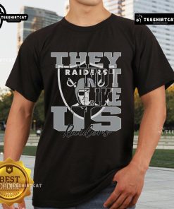 Top They Not Like Us Las Vegas Raiders NFL football T-shirt featuring bold graphics and team colors, perfect for fans.