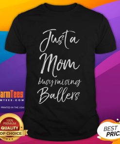 Alt Text: Cute Basketball Mother T-Shirt design featuring 'Just A Mom Busy Raising Ballers' slogan for proud basketball moms.