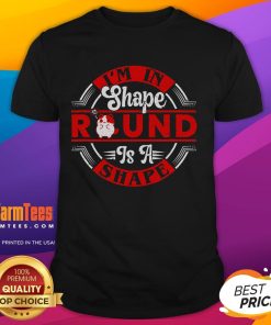 Cute cat wearing 'I'm In Shape Round Is A Shape' funny t-shirt, perfect for cat lovers and humor enthusiasts.