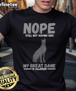 Funny 'Nope Still Not Having Kids My Great Dane Is Allergic' T-Shirt design featuring a playful dog graphic and humorous text.