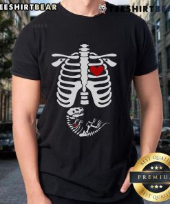 Funny pregnant woman wearing a dinosaur skeleton Halloween costume t-shirt, showcasing a playful and unique pregnancy outfit.