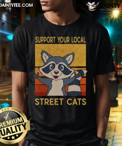 Funny Raccoon Support Your Local Street Cats T-Shirt featuring a playful raccoon design and vibrant colors, perfect for cat lovers.