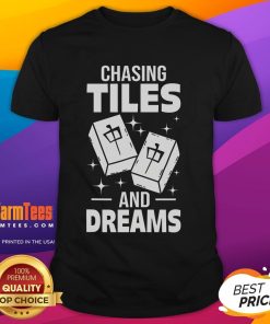 Asian player wearing 'Good Mahjong Chasing Tiles And Dreams' T-shirt, showcasing a passion for Mahjong and cultural pride.