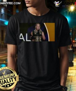 Alicia Keys wearing a t-shirt that reads Dei 'A Gift' during her Grammys speech, addressing Trump's anti-diversity comments.