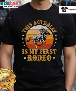 Vintage retro sunset cowboy t-shirt design with 'My First Rodeo' text, perfect for rodeo enthusiasts and casual wear.