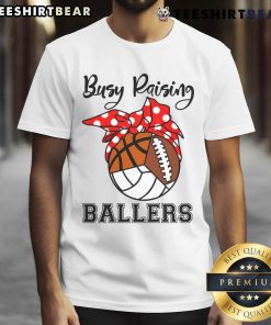 Official Busy Raising Ballers T-Shirt featuring volleyball, football, and basketball designs for active sports enthusiasts.