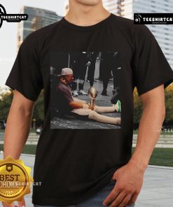 Alt Text: Official Jalen Hurts Celly Cigar Trophy Fan T-Shirt featuring Jalen Hurts celebrating with a cigar and trophy design.