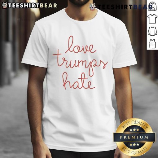 Official Lingua Franca Love Trumps Hate T-Shirt featuring bold text in a stylish design promoting love over hate.