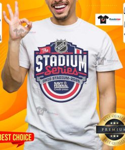 Alt Text: Official 2025 NHL Stadium Series event primary logo T-shirt featuring vibrant team graphics and stylish design.