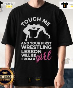Official Touch Me And Your First Wrestling Lesson Will Be From A Girl T-Shirt featuring bold graphic design and playful text.