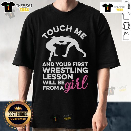 Official Touch Me And Your First Wrestling Lesson Will Be From A Girl T-Shirt featuring bold graphic design and playful text.