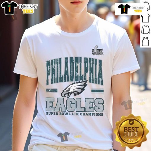 Alt Text: Original Philadelphia Eagles Super Bowl Champs T-Shirt featuring team logo and championship graphics in vibrant colors.