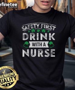 Premium Safety First With A Nurse Gift St Patrick's Day T-Shirt featuring a festive design for nurses celebrating the holiday.