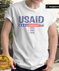 Alt Text: Premium USAID Waste Abuse Fraud Since 1961 T-Shirt showcasing a bold graphic design for awareness and activism.
