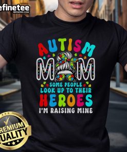 Top Autism Mom Raising Hero T-Shirt featuring a groovy messy bun design for Autism Awareness.