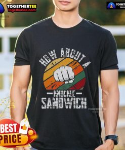 Boxing trainer wearing 'How About A Knuckle Sandwich' T-shirt, showcasing passion for boxing and coaching style.