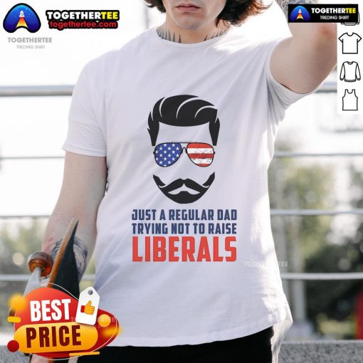 Top Just A Regular Dad Trying Not To Raise Liberals T-Shirt design featuring bold text for humorous parenting.