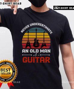 Vintage music t-shirt featuring a cool guitarist with a retro guitar design, perfect for music lovers and musicians.
