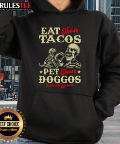 Skeleton hoodie with 'Eat Those Tacos, Pet Those Doggos' design, perfect for Halloween and taco lovers.