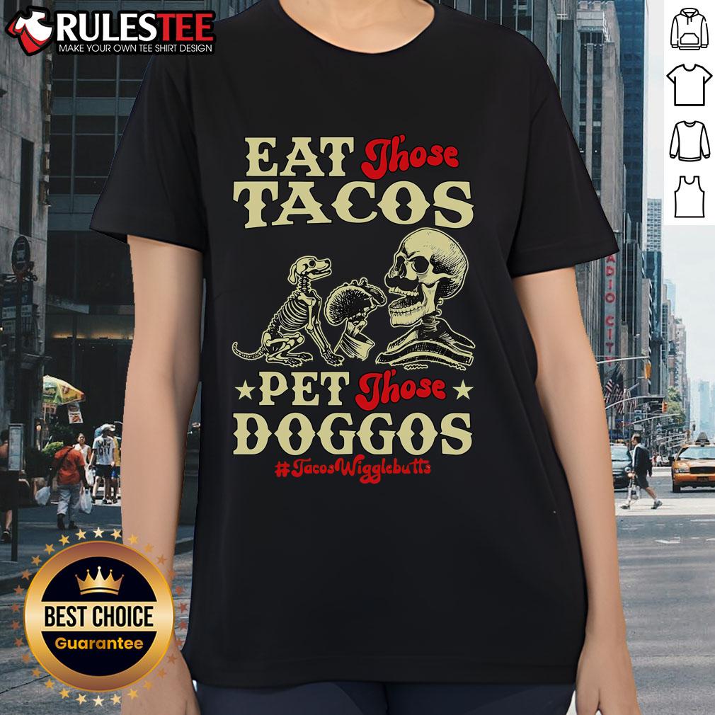 Awesome Eat Those Tacos Pet Those Doggos Skeleton Ladies Tee Skeleton ladies in taco-themed shirts enjoying tacos and petting dogs, showcasing the Awesome Eat Those Tacos Pet Those Doggos Tee.