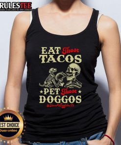 Skeleton wearing 'Eat Those Tacos, Pet Those Doggos' tank top, surrounded by colorful tacos and playful dogs.