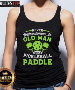 Old man in a tank top holding a pickleball paddle, showcasing confidence and skill in pickleball sports.