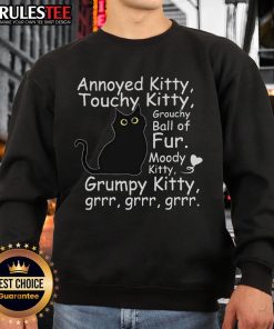 Annoyed cute black cat in a cozy sweatshirt, showcasing its grouchy yet adorable personality. Perfect touchy kitty moment!