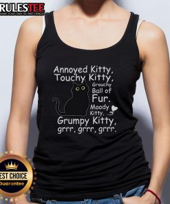 Annoyed black cat wearing a tank top, looking grouchy and cute, showcasing its playful personality as a touchy kitty.