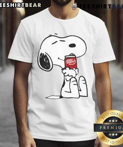 Alt Text: Cute Snoopy hugs Dr Pepper on a stylish t-shirt, perfect for fans of Peanuts and refreshing beverages.