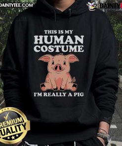 Adorable dog in a funny hoodie saying 'This is my human costume, I'm really a pig' showcasing pet humor and costume fun.