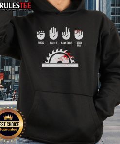 Funny carpenter playing rock-paper-scissors with a table saw, wearing a humorous hoodie for woodworking enthusiasts.