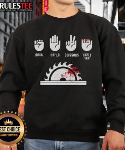 Alt Text: Funny carpenter playing rock-paper-scissors with a table saw on a sweatshirt design, perfect for woodworking enthusiasts.